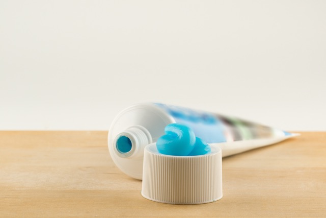 Blue toothpaste on cap from open tube | Orthodontist in Tomball, TX